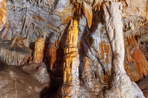 Beautiful Stalagmite Formation In A Limestone Cave Photo Pathway In
