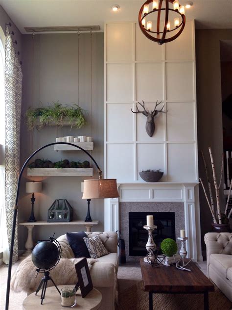 A Living Room Filled With Furniture And A Fire Place In Front Of A Wall