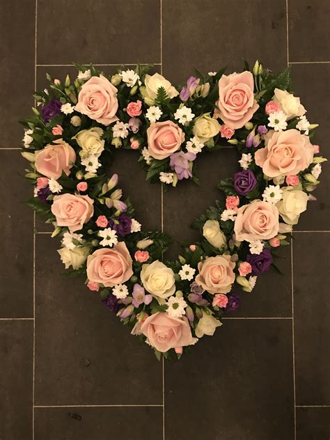 Pink Purple And White Heart Shaped Funeral Flowers Tribute Wreath