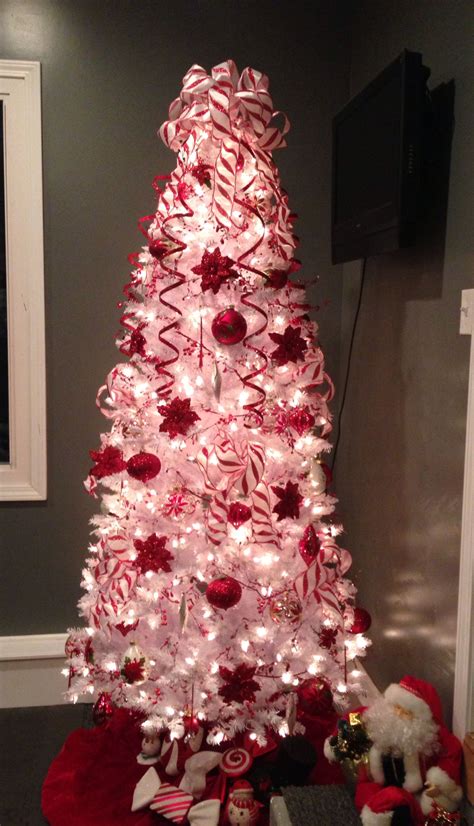 Ain't it the sweetest game ever? Poinsettia and candy cane Christmas Tree | White christmas ...