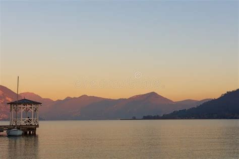 Sunset Over The Quiet Waters Of Lake Iseo Stock Photo Image Of