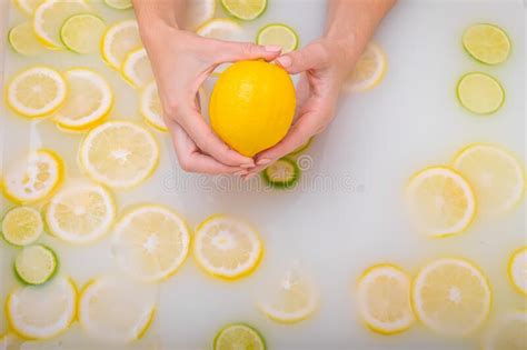 Ripe Lime In The Hands Of A Woman Top View Girl Takes A Milk Bath With