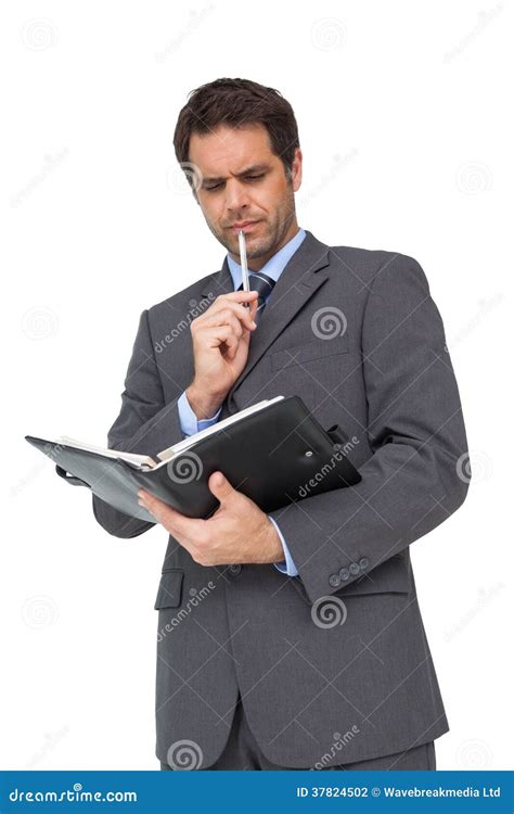 Handsome Thoughtful Businessman Holding His Diary Stock Photo Image