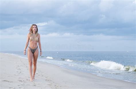 Beautiful Tanned Woman In Swimsuit Is Walking On Tropical Beach Stock Image Image Of Hippie