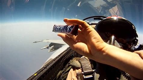 Fighter Jet Pilots Pass Snickers Chocolate Bar To Each Other Mid Flight
