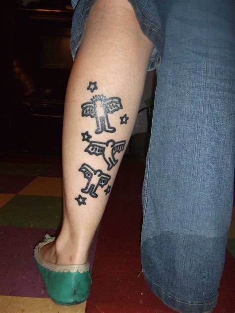 A Person With A Tattoo On Their Leg