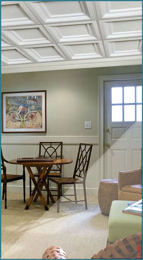 Some coffered ceilings contain a light around the center of each panel, while others have the decorative trim panels bordering a hanging lamp or pendant, like a chandelier. A coffered ceiling makes a statement in this walkout ...