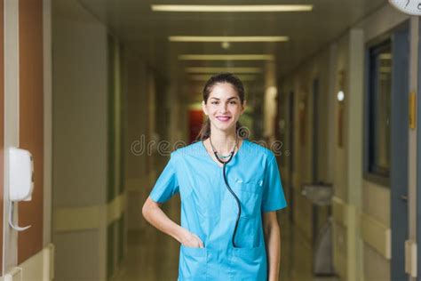 A Beautiful Young Woman Doctor Or Nurse Is Standing In A Hospital