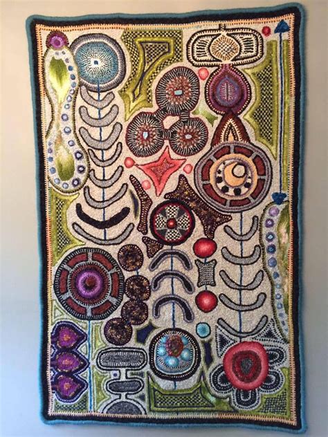 A Wall Hanging With An Artistic Design On It