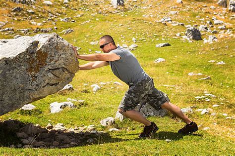 Man Pushing Rock Stock Photos, Pictures & Royalty-Free Images - iStock