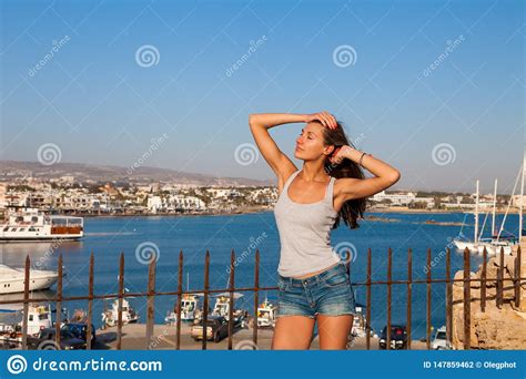 Beautiful Tourist Woman On The Old Castle On Mediterranean Sea Coast