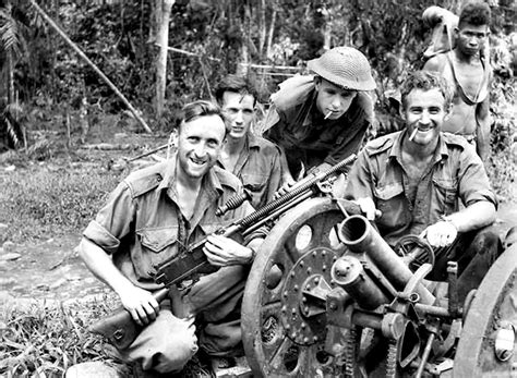 Australian Soldiers And A Papuan Guide Show Off A Captured Type 92 Battalion Gun And A Type 1