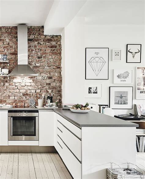 Modern White Kitchen With Brick Wall