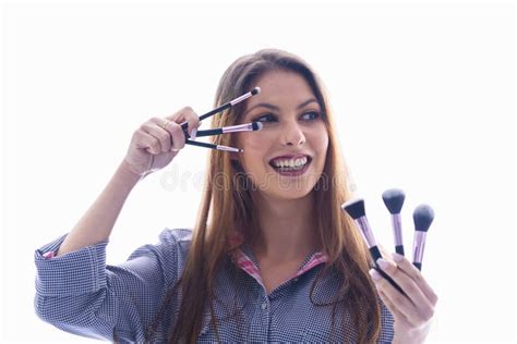 Woman Holding An Assortment Of Makeup Brushes Stock Photo Image Of