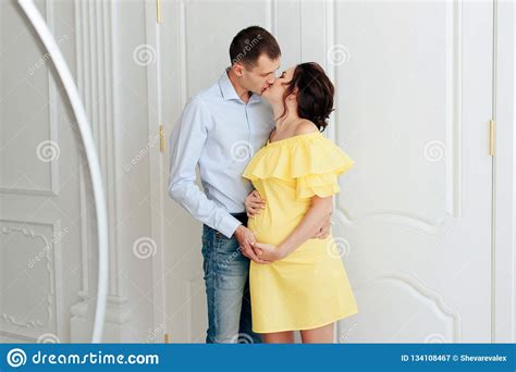 Young Married Couple Waiting For A Miracle Pregnant Wife With Her
