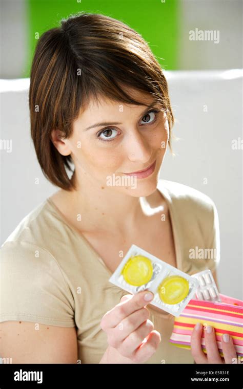 Woman Holding A Condom Stock Photo Alamy