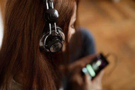 Beautiful Young Woman In Headphones Listening To Music Girl Alone