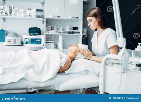 Beautician Makes Face Massage To Female Patient Stock Photo Image Of