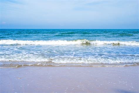 Light Blue Sea Waves On A Clean Sandy Beach Stock Photo Image Of