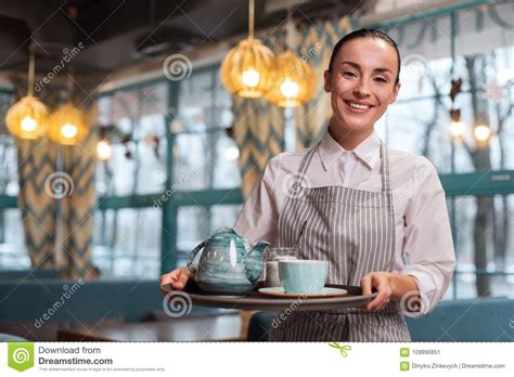 Pleasant Appealing Waitress Serving Tea Stock Image Image Of Employee