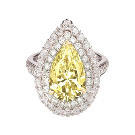 Gia 201 Carat Fancy Yellow Diamond Oval Ring With Yellow Diamonds