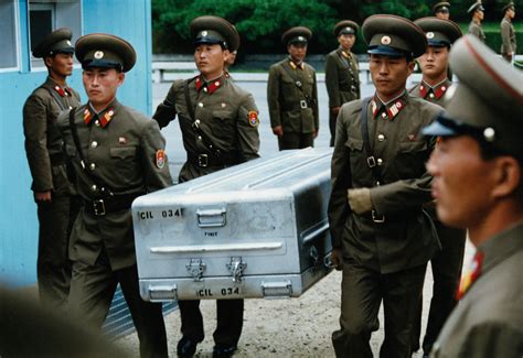Members Of The North Korean Army Bring The Casket To The South Korean
