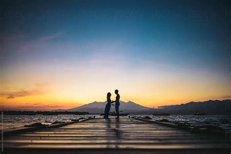Young Couple Silhouette On The Beach At Sunset By Alexander Grabchilev