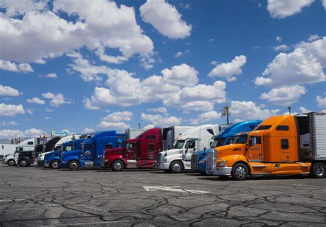 Row Of American Trucks Parked At Truck Stop Innovative Machine Solutions