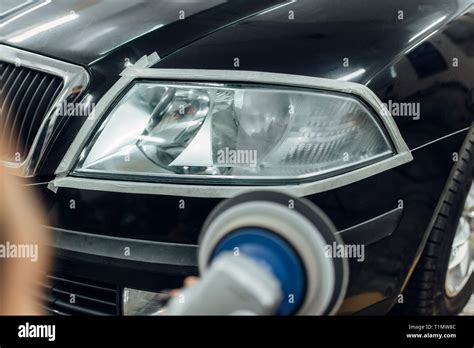 Detailing Of Car Headlights With Polishing Machine Stock Photo Alamy