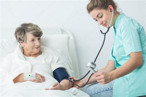 Nurse Take Care Of Patient Stock Photo By ©photographeeeu 106513364