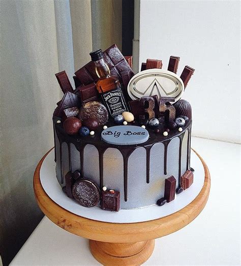 Liquor cake with mini alcohol bottles. Cakes image by Sara Caiola | Drip cakes, Whisky cake