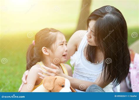 Mother Comforting Crying Child Stock Image Image Of Green Console