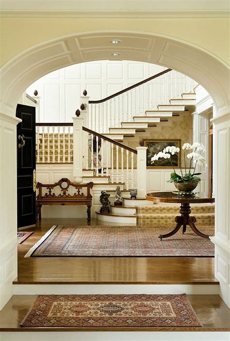Alluring Entrance Hall With White Arched Partition Wall