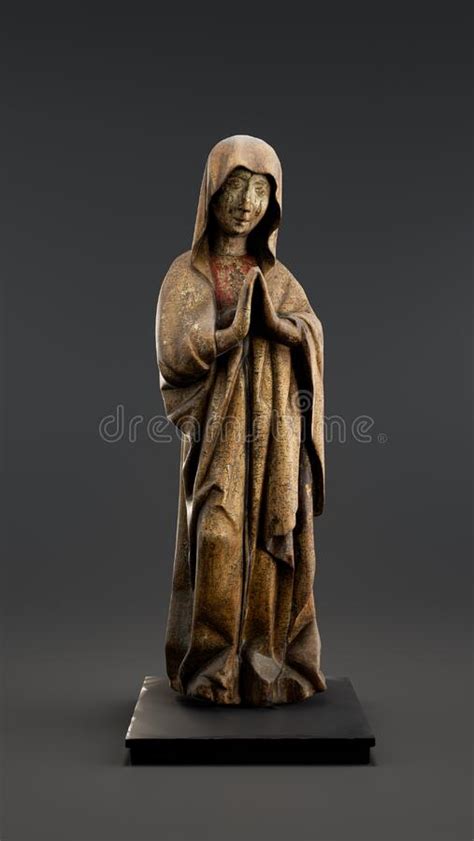 A Gothic Sculpture Depicting A Figure In Contrapposto Our Lady Of