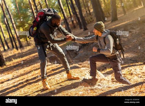 Two Friends Guys Hiking Together At Countryside Stock Photo Alamy