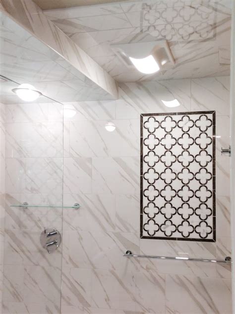 Polished white italian calacatta marble luxury waterjet mosaic wall tile in rhombus diamond pattern with black marble accent dots. Calacatta Tile Shower with White and Brown Marble Accent ...