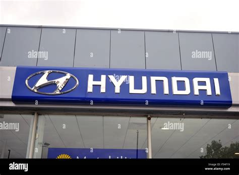 A Hyundai Sign Above The Entrance To A Hyundai Car Dealership In The Uk