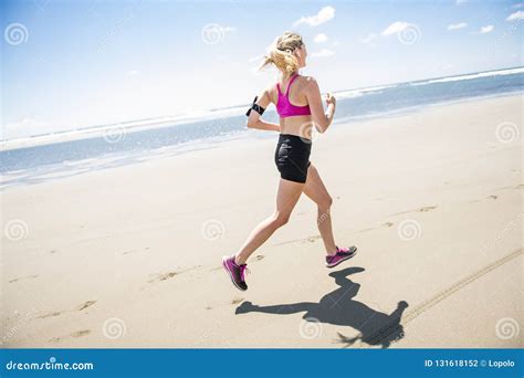 Young Woman Jogging On The Beach In Summer Day Athlete Runner
