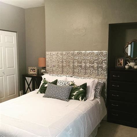 With leftover floor tile, the cousins actually created a headboard right in our studio. Aluminum Ceiling Tile Headboard is complete! #house #diy # ...