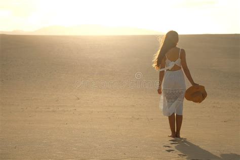 Sunset In The Desert Young Woman With White Dress Walking In The