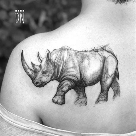 Sketchy Rhino Tattoo On The Left Shoulder Blade