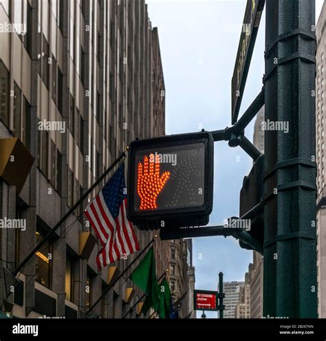 A Pedestrian Crossing Signal For Stopping On Fifth Avenue In New York