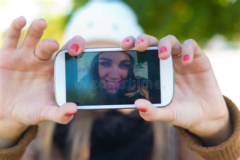 Portrait Of Beautiful Girl Taking A Selfie With Mobile Phone Stock