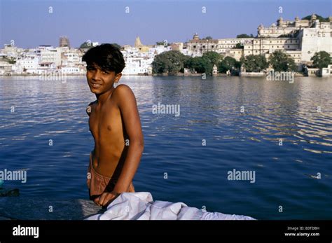 Asia India Udaipur Indian Boy By A Bathing Lake Nr Stock Photo Alamy