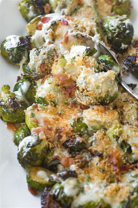These parmesan brussel sprouts are a new favorite side dish. Roasted Brussels Sprouts with Parmesan Sauce | The Cozy Apron