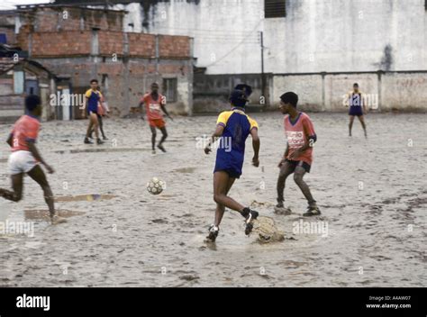 Children Playing Football In A Muddy Ground Mare Favela Rio Brazil