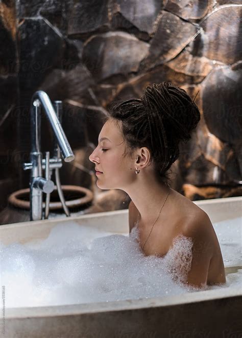 Attractive Unusual Girl Takes A Hot Bath By Stocksy Contributor