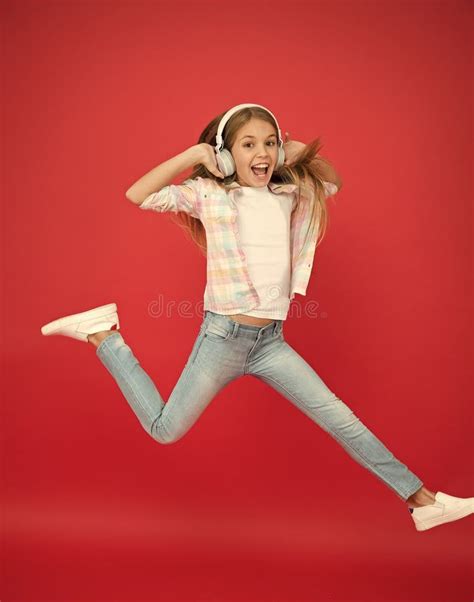 Jumping Mid Air Easy Listening Music Small Girl Listening To Music In