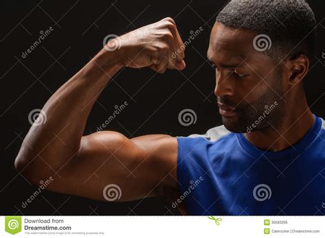 Young Man Flexing Muscles With Barbell In Gym Royalty Free Stock Image