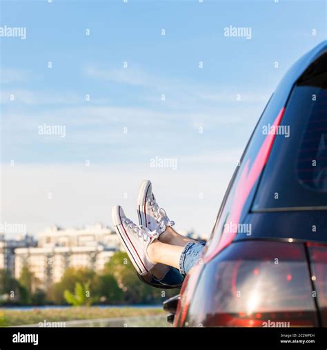 Feet Outside The Window Cityscape On Background Woman Driver Put Feet